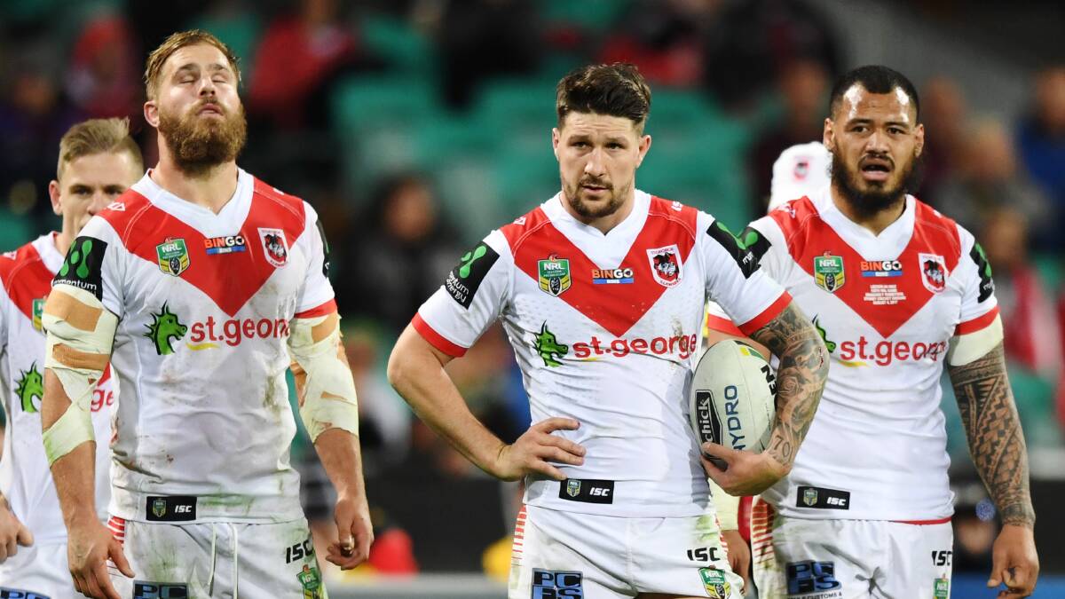 Free fall: Gareth Widdop (centre) during the loss to Souths. Picture: AAP Image/David Moir