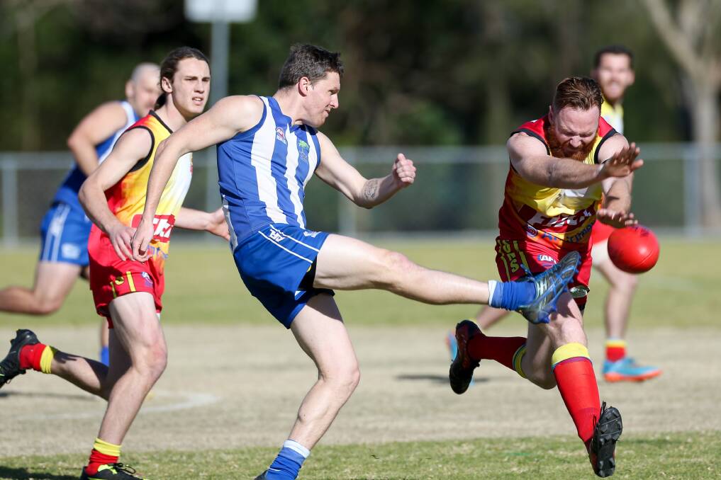 On the boot: Figtree's Simon Quinn avoids the Shellharbour pressure at Figtree Oval on Saturday. Picture: Adam McLean