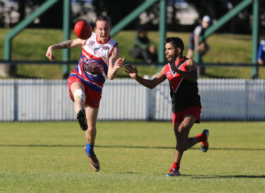 Showdown: Bulldogs' Aaron Jory and Lions player Dale Carter and North Dalton Park last month. Picture: Robert Peet