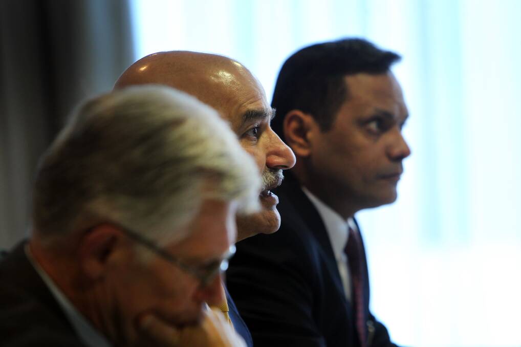 WELCOME BACK: Sanjay Sharma (right) took a $330,000 termination payout from Wollongong Coal but was back working full-time as company secretary "four or five" months later.