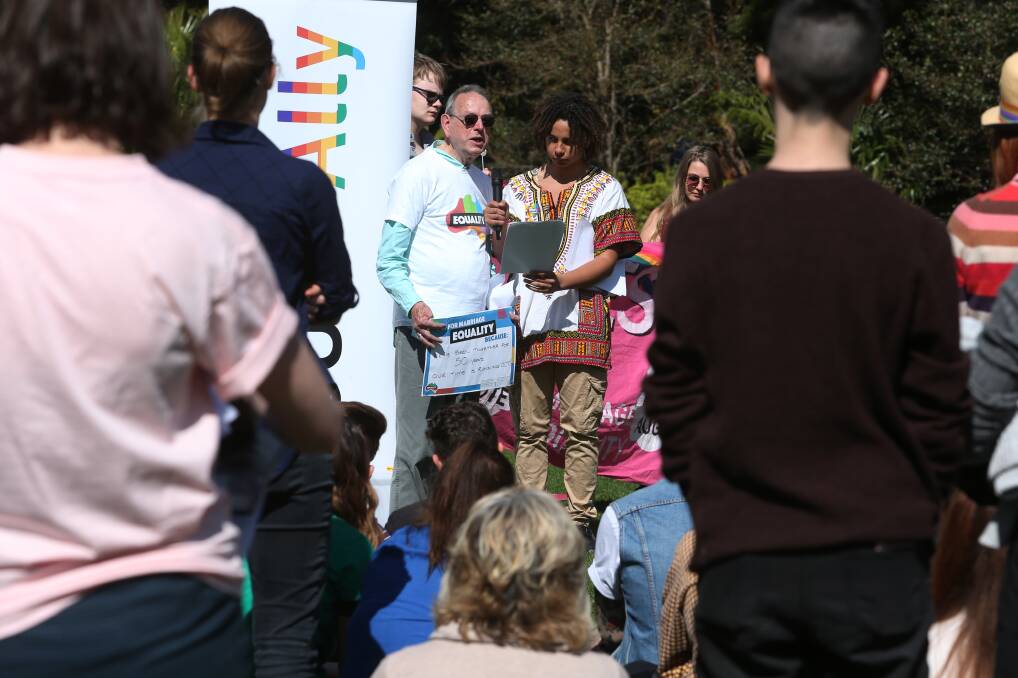 Peter De Waal with his grandson Jamil Badi talking during the marriage equality rally at the UOW. Picture: Robert Peet