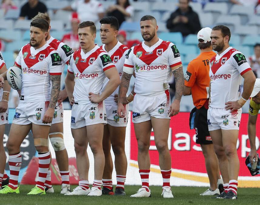 BITTER PILL: Dragons players look on as their 2017 finals hopes were dashed in round 26 last year. Picture: AAP