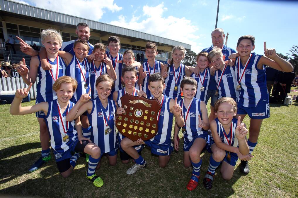 Winning ways: Figtree Greys' under 11 team celebrate winning the AFL South Coast premiership.