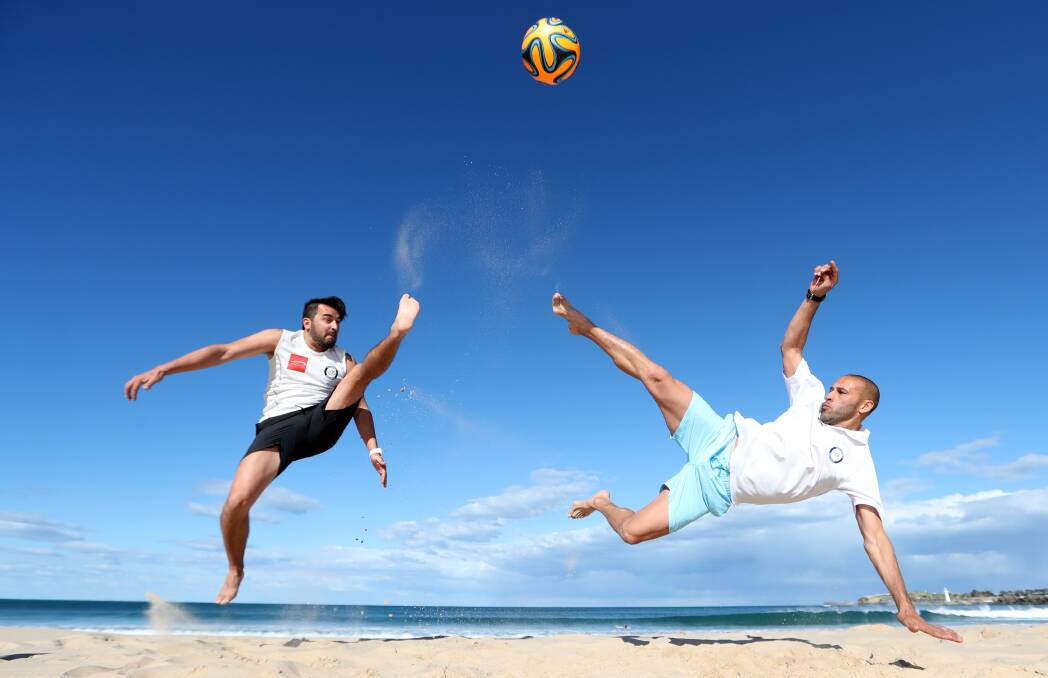 CELEBRATION: Wollongong Beach Soccer's Christian Gonzalez and Alfredo Esteves at North Gong Beach. Picture: Sylvia Liber