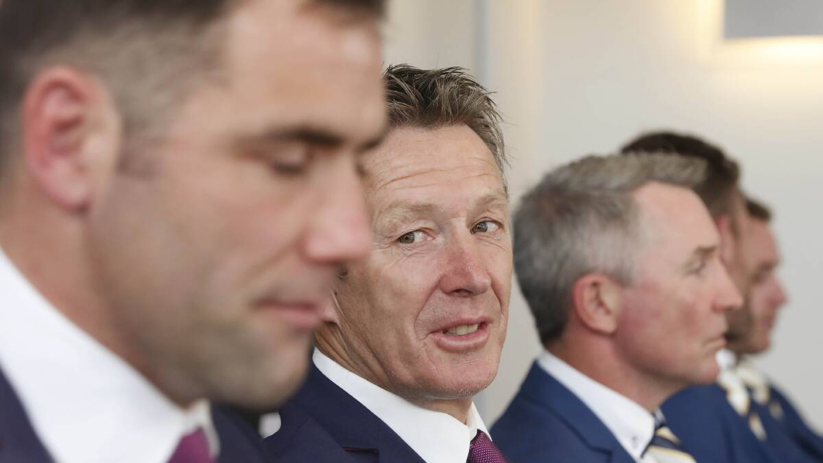 Melbourne Storm head coach Craig Bellamy looks at the team captain Cameron Smith during a press conference at Luna Park in Sydney. Picture: AAP Image/Daniel Munoz