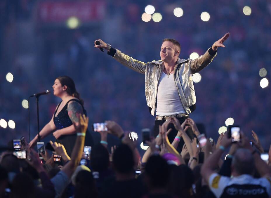 POWERFUL: Macklemore performs Same Love before last year's NRL grand final between Melbourne and North Queensland. Picture: AAP