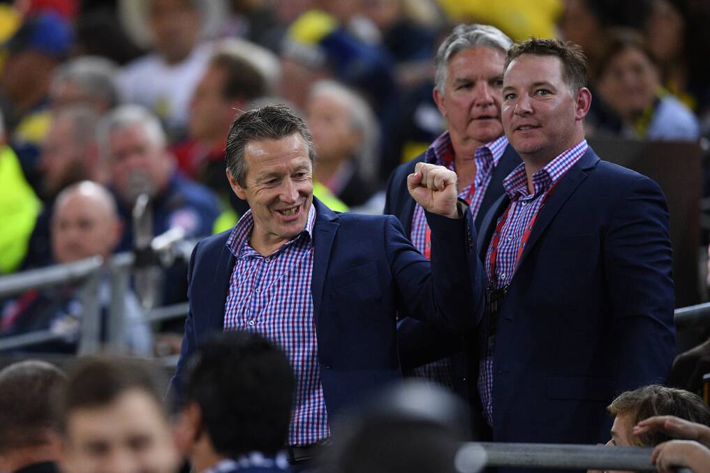 WINNING PAIR: Melbourne assistant coach Adam O'Brien (right) and Craig Bellamy celebrate their side's grand final victory. Picture: AAP 
