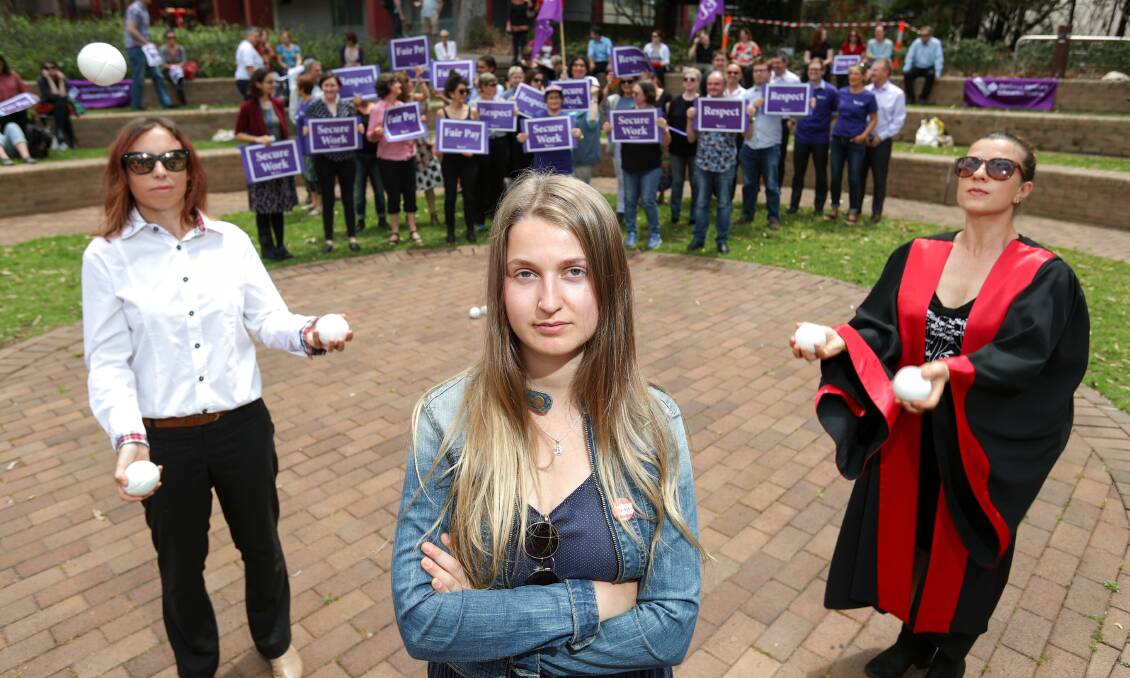 JOB SECURITY FIGHT: University of Wollongong student Isabelle Liddy with performers Neisha Murphy and Emma Khourey. Picture: Adam McLean.