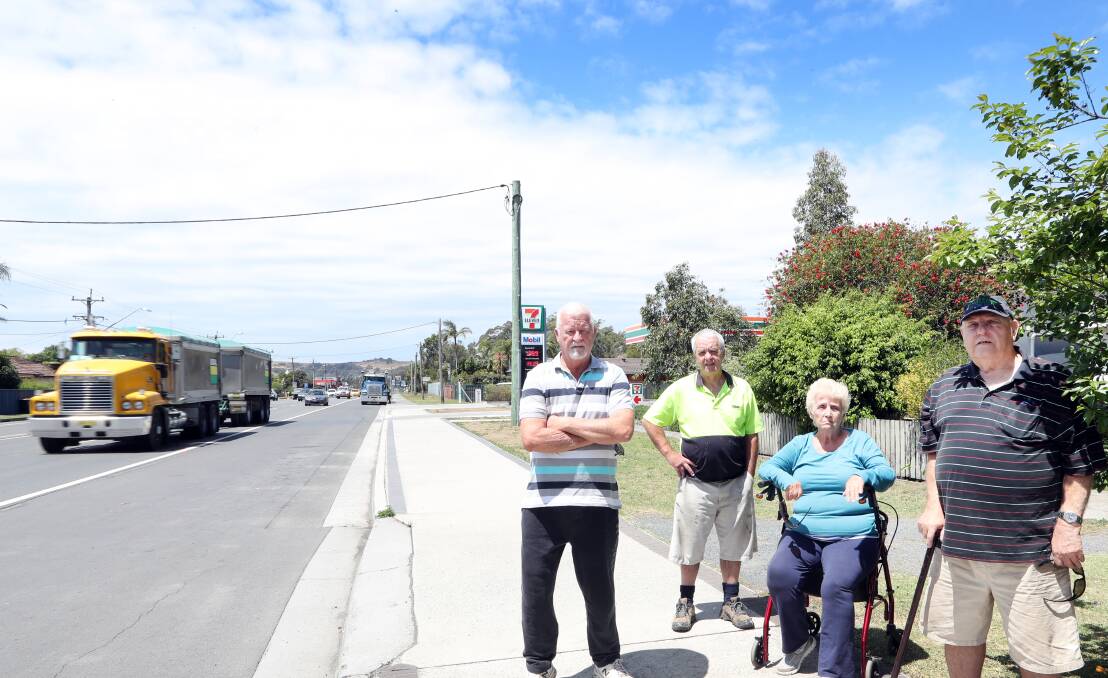 BLOCKED OFF: Albion Park Rail resident Don Tate, Danny Phillips and Ann and Brian Craddock are unhappy with trucks heading to nearby 7-11 parking across their driveways Picture: Sylvia Liber