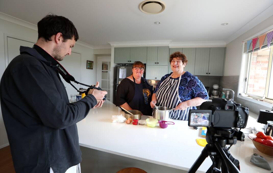 Penny Melville-Brown with Johanne Holt, being filmed in a Kiama kitchen by Penny's nephew Toby Melville-Brown. Picture: Sylvia Liber