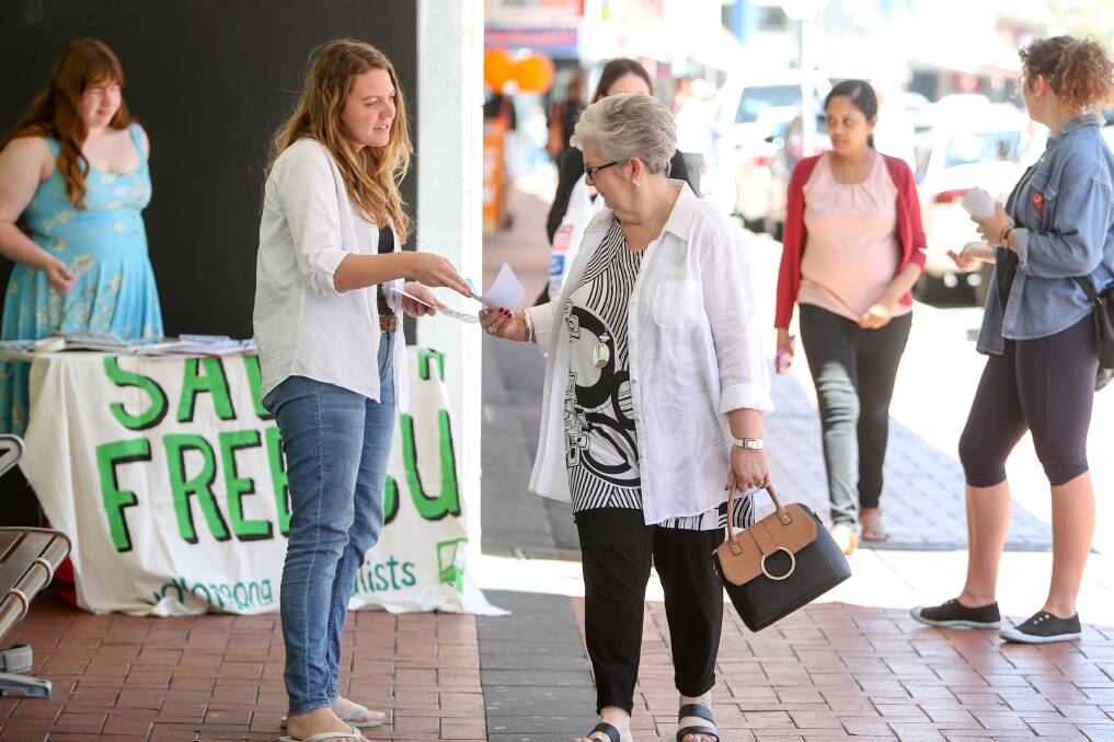 Taking a stand: Chloe Rafferty handing out flyers in Crown Street ahead of this Sunday's rally to save the Gong Shuttle. Picture: Adam McLean