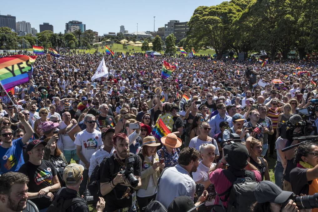 LOVE IS IN THE AIR: Crowds at Prince Alfred Park in Sydney celebrate the verdict on Wednesday. Picture: Jessica Hromas.