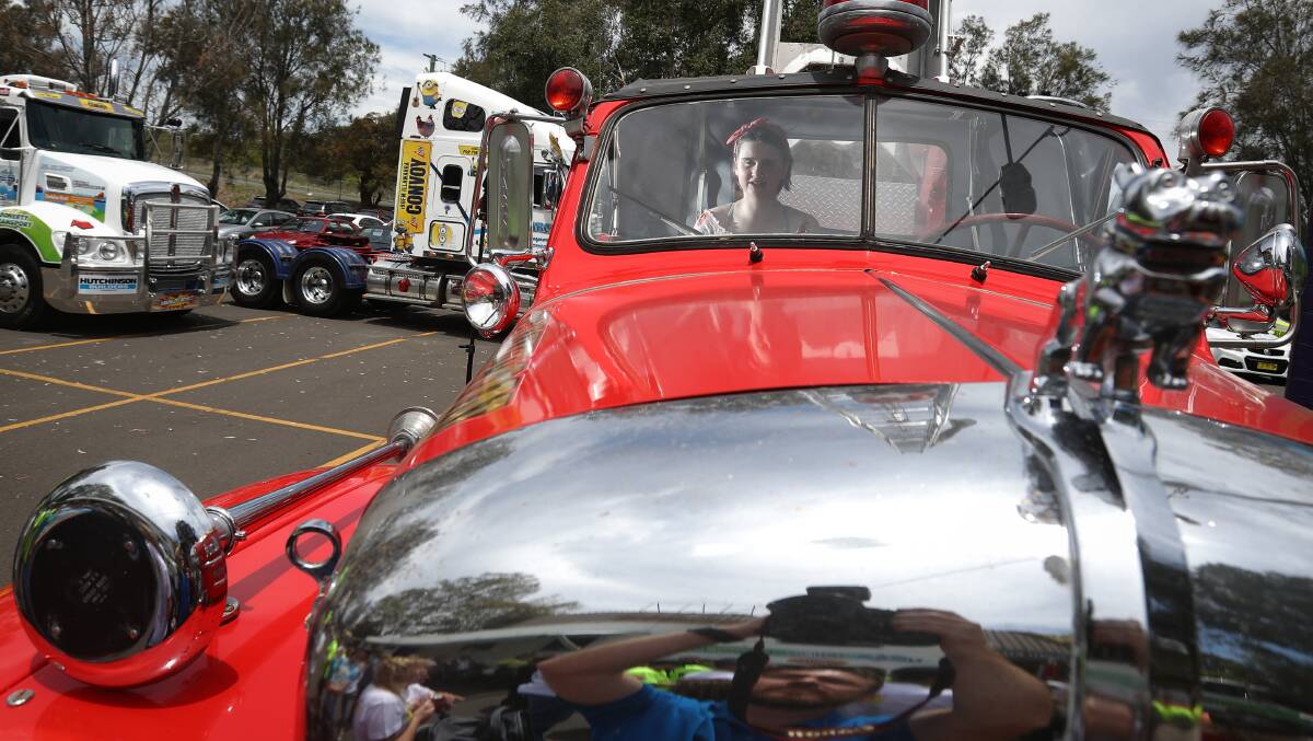 Fifteen-year-old Grace Barnett tests out a vintage truck ahead of Sunday's convoy. Picture: Adam McLean