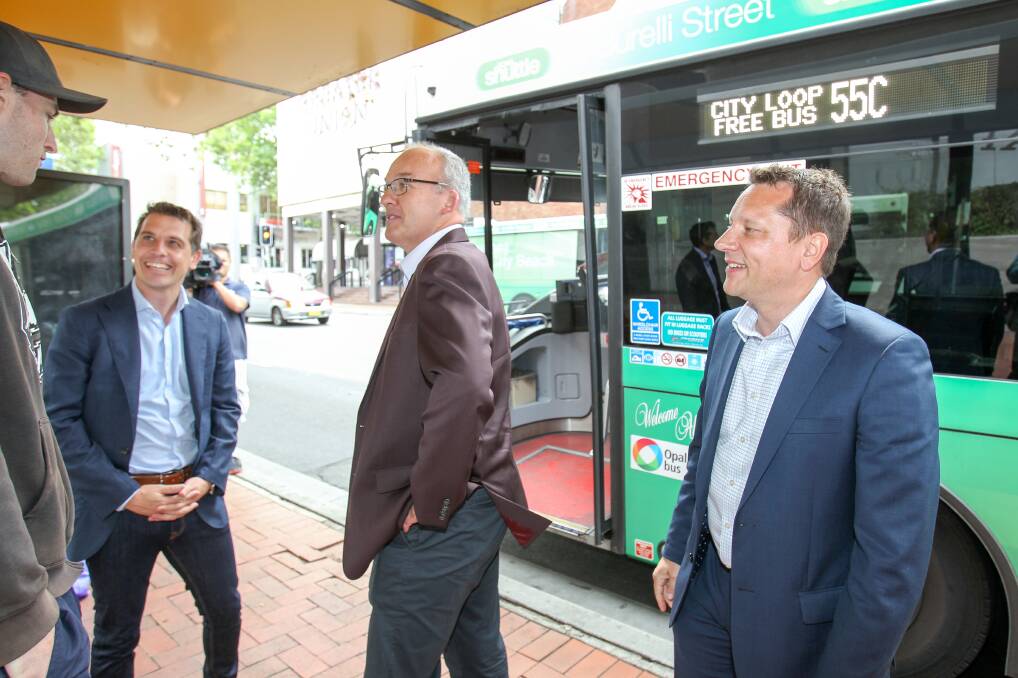 Opposition Leader Luke Foley with Shadow Treasurer and Member for Keira, Ryan Park and Member for Wollongong, Paul Scully, talking to a bus passenger at the  Burelli St bus stop on Saturday. Picture: Adam McLean