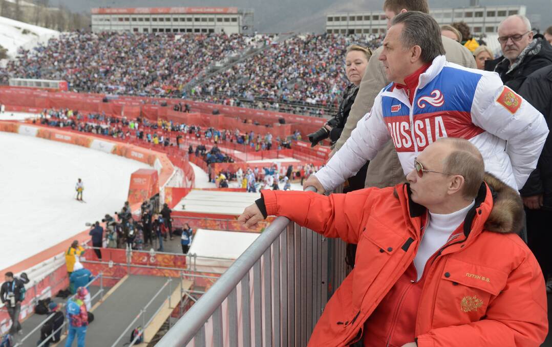 Looking on: Russian President Vladimir Putin and sports minister Vitaly Mutko in 2014. Picture: AP Photo/RIA-Novosti, Alexei Nikolsky