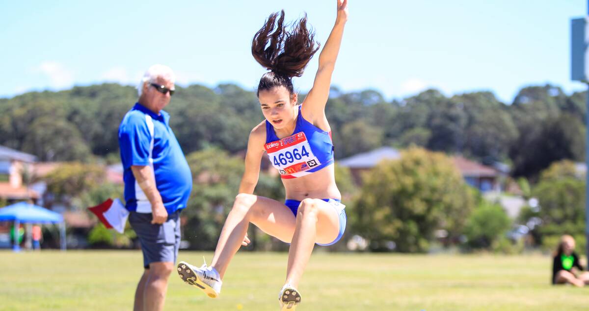 Lift off: Bailey Holland takes to the long jump event at the South Coast Zone Little Athletics Championships. Picture: Georgia Matts