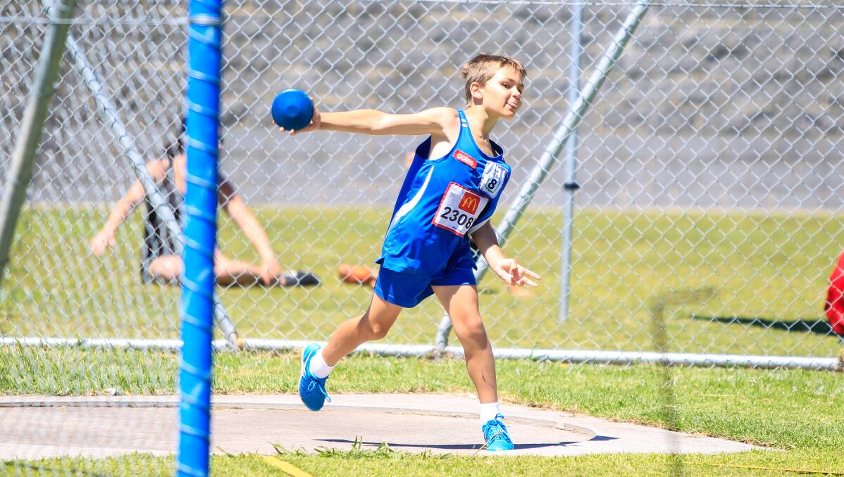 Launch: Mt Warrigal's Aiden Williams in the discus event at South Coast zone Little Athletics Championships at Myimbarr Community Park.