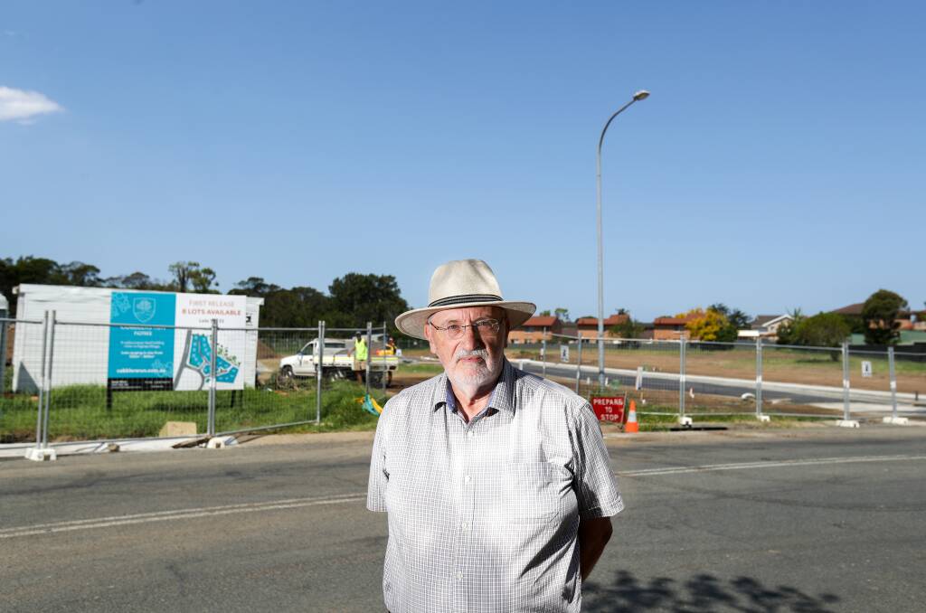 DISAPPOINTED: John Mathieson at the 'Cobblers Run' development. He and his neighbours would have benefited from the flood reduction measures. Picture: ADAM McLEAN.