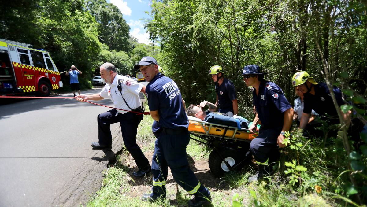 SAFELY OUT: Emergency service personnel used the Ferno Mule buggy to rescue a 44-year-old male mountain bike rider who crashed his bike into a tree at a track at Mount Kembla. Picture:  Adam McLean