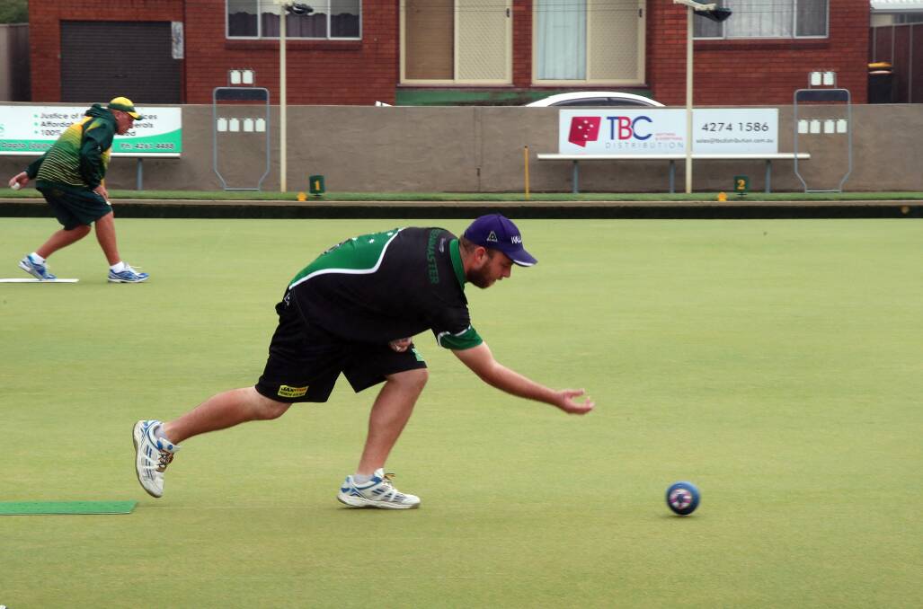 Tough conditions: Greg Jeans was one of many players forced to bowl through torrential rain on Sunday. Picture Sylvia Liber. 