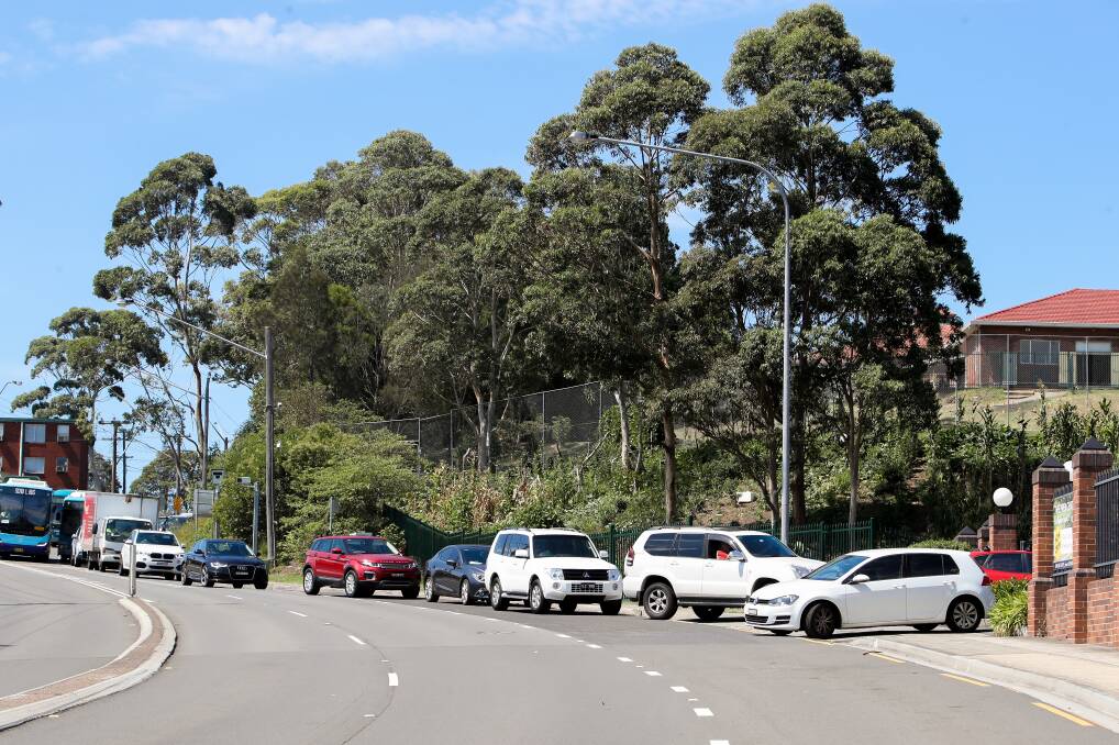 Nothing wrong: The queue of traffic that occurs outside the Illawarra Grammar School during drop-off and pick-up times. Picture: Adam McLean