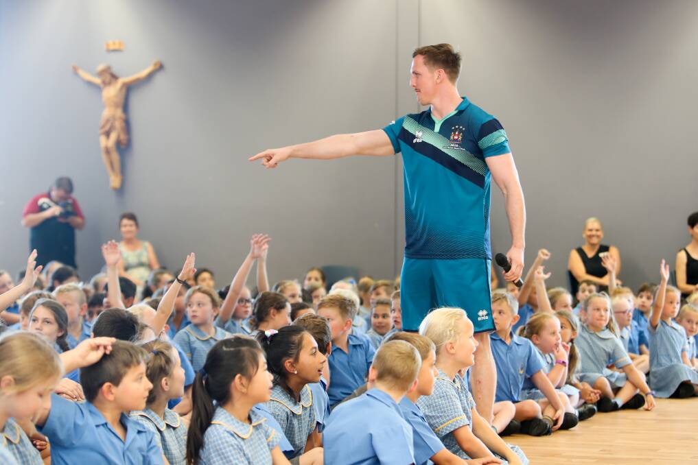  Wigan's Dan Sarginson during the event teaching children about health and well-being.