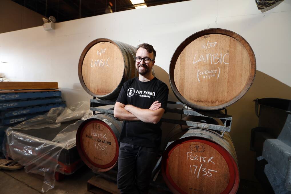 Happy birthday: Five Barrels' Phil O'Shea will be sharing the beers in these oak barrels this weekend as part of the brewery's second anniversary celebrations. Picture: Sylvia Liber