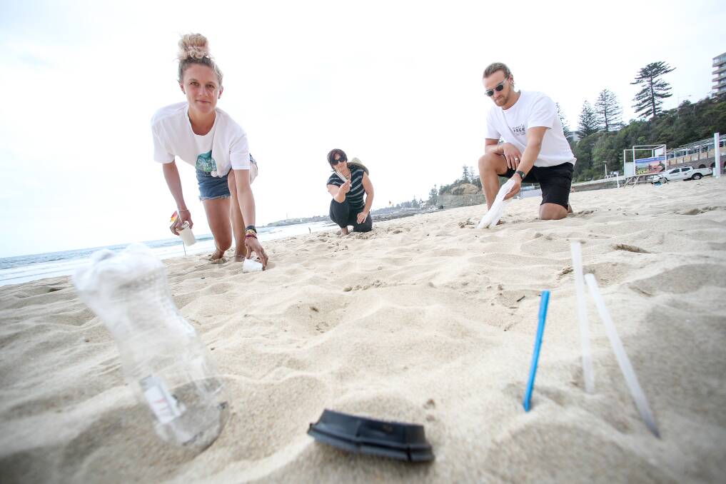 Maddie Wray from the Surfrider Foundation, Mithra Cox, and Andy Gray from Plastic Free Wollongong at North Wollongong beach preparing for Beat the Bottle on Sunday. Picture: Adam McLean