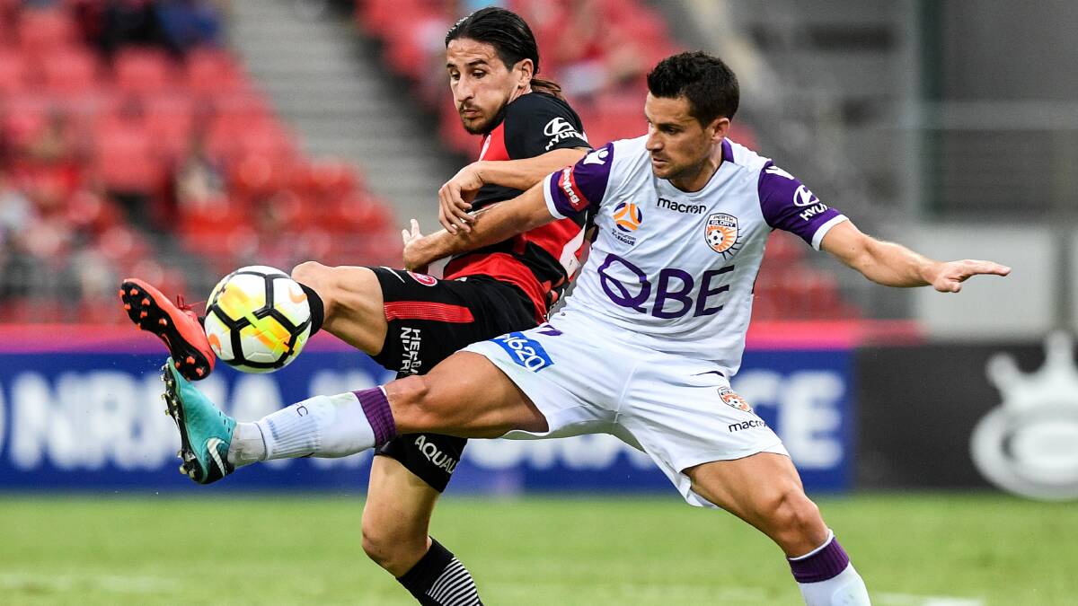 LAST TIME AROUND: Wanderers' Raul Llorente battles with Perth Glory's Joel Chianese during round 22 last season. Picture: AAP Image/Brendan Esposito