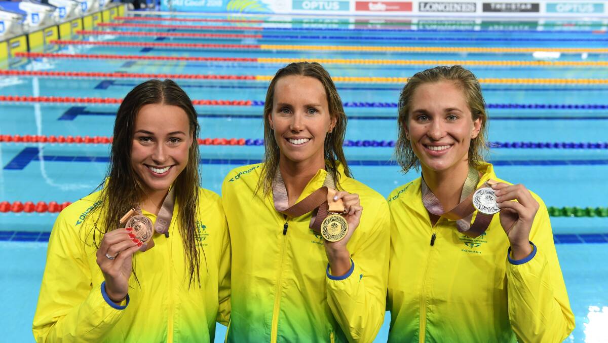 Gold rush: Emma McKeon (centre). Picture: AAP Image/Dave Hunt