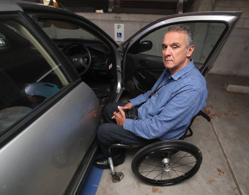 Steve Petrolati needs the extra space in a disabled parking spot to get in and out of his wheelchair. When able-bodied drivers take a disabled space it means he has to turn around and go home. Picture: Robert Peet