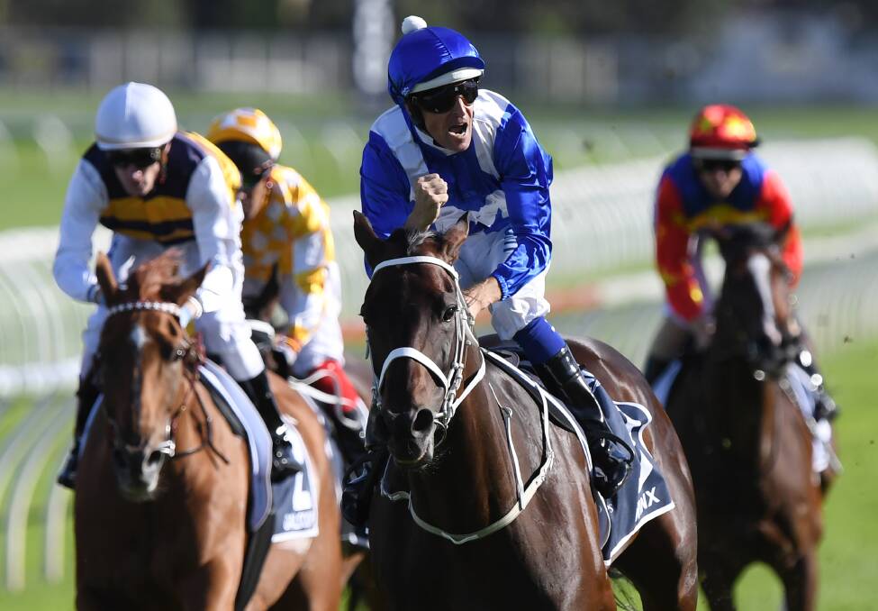 Unstoppable: Jockey Hugh Bowman on Winx wins the Queen Elizabeth Stakes during The Championships. Picture: AAP Image/David Moir