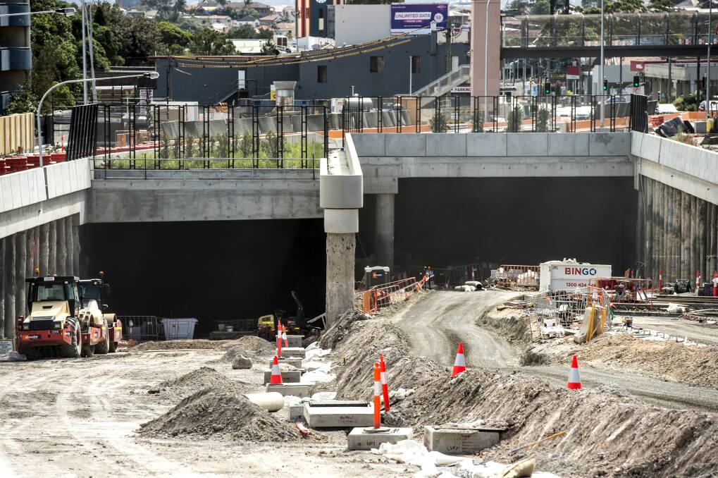 Dig it: Work on two tunnels in Sydney's WestConnex project. Transport for NSW has approved a plan to send tonnes of rock dug up by rail to Port Kembla but can't say when it will start. Picture: Steven Siewert