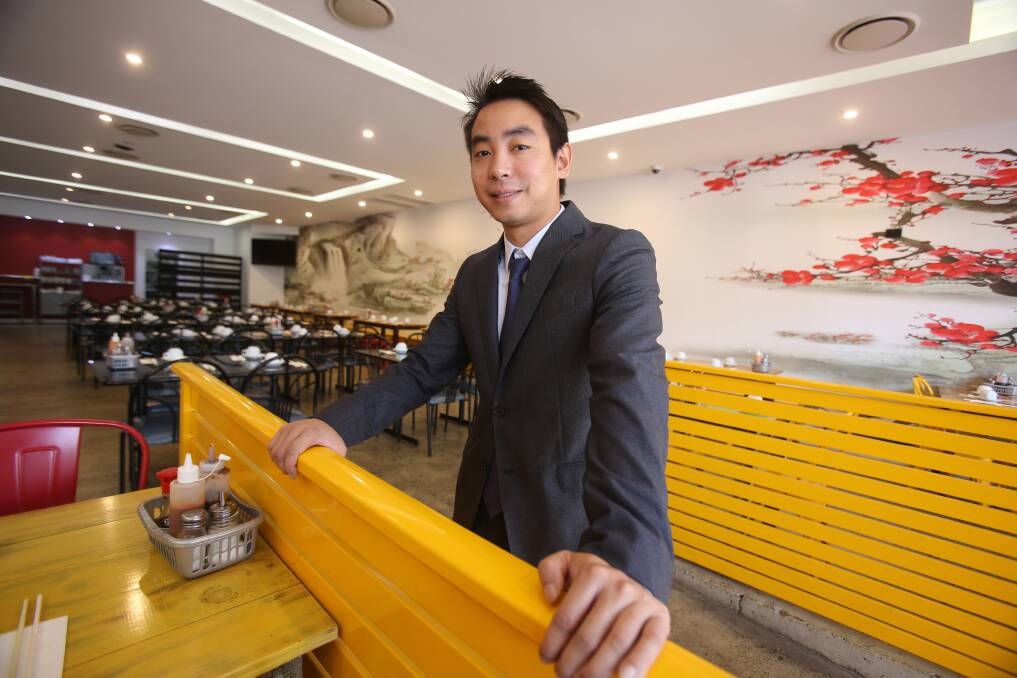 LOCAL FAVOURITE: Michael Li, proprietor of Food World in Wollongong, which will start delivery. Picture: ROBERT PEET.