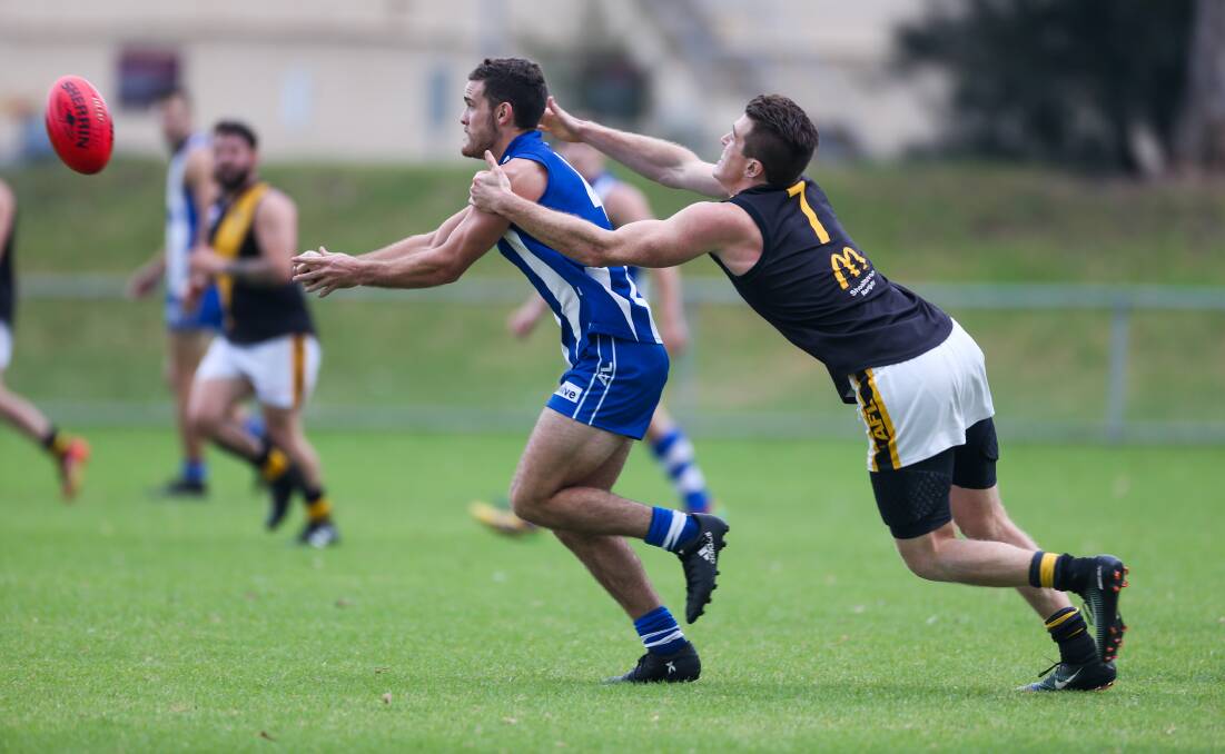 Hands off: Figtree's Nick Stacey handpasses against Bomaderry. The Roos take on Northern Districts on Saturday. Picture: Georgia Matts