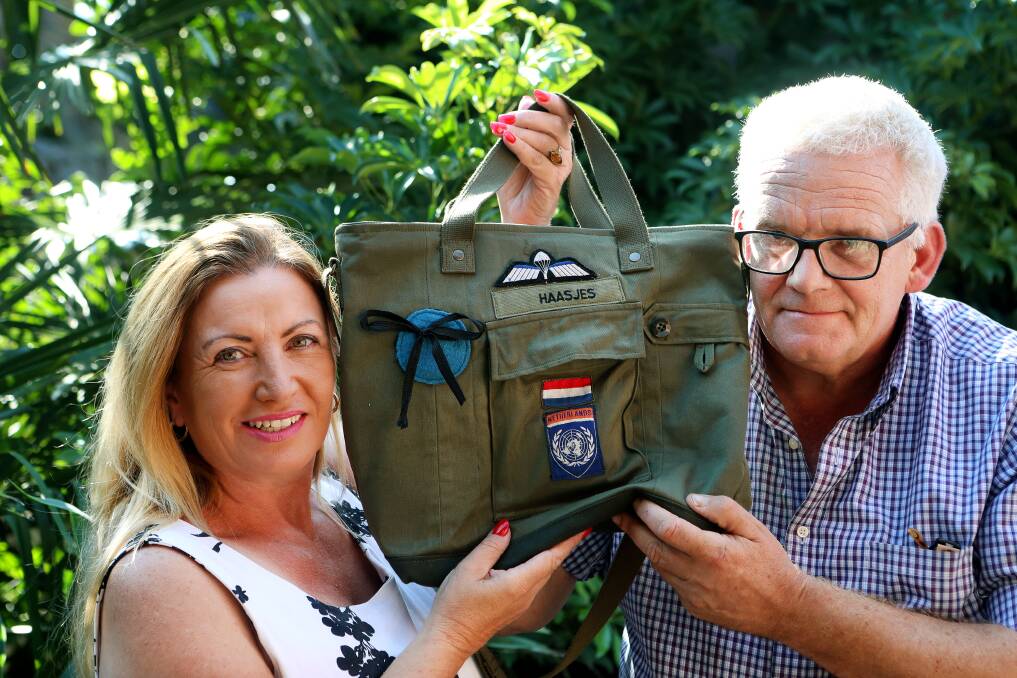 Mary and Henk Haasjes show off the handbag they had made which uses his old military uniform. Picture:: Sylvia Liber
