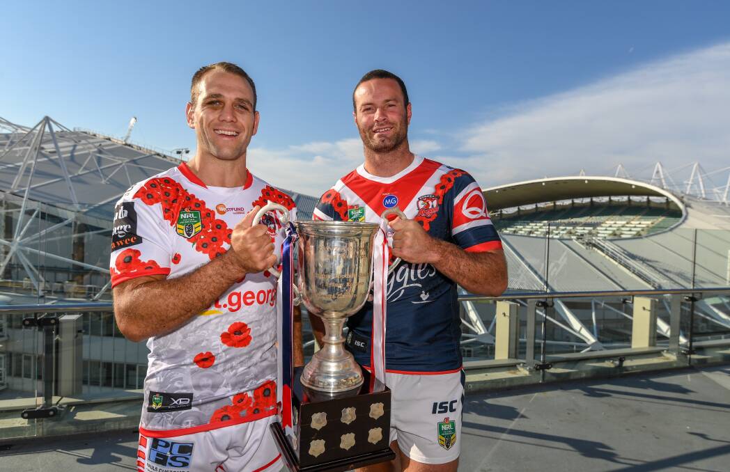 Special day: Jason Nightingale and Boyd Cordner pose with the Anzac Day Trophy ahead of Wednesday's blockbuster. Picture: AAP Image/Peter Rae.