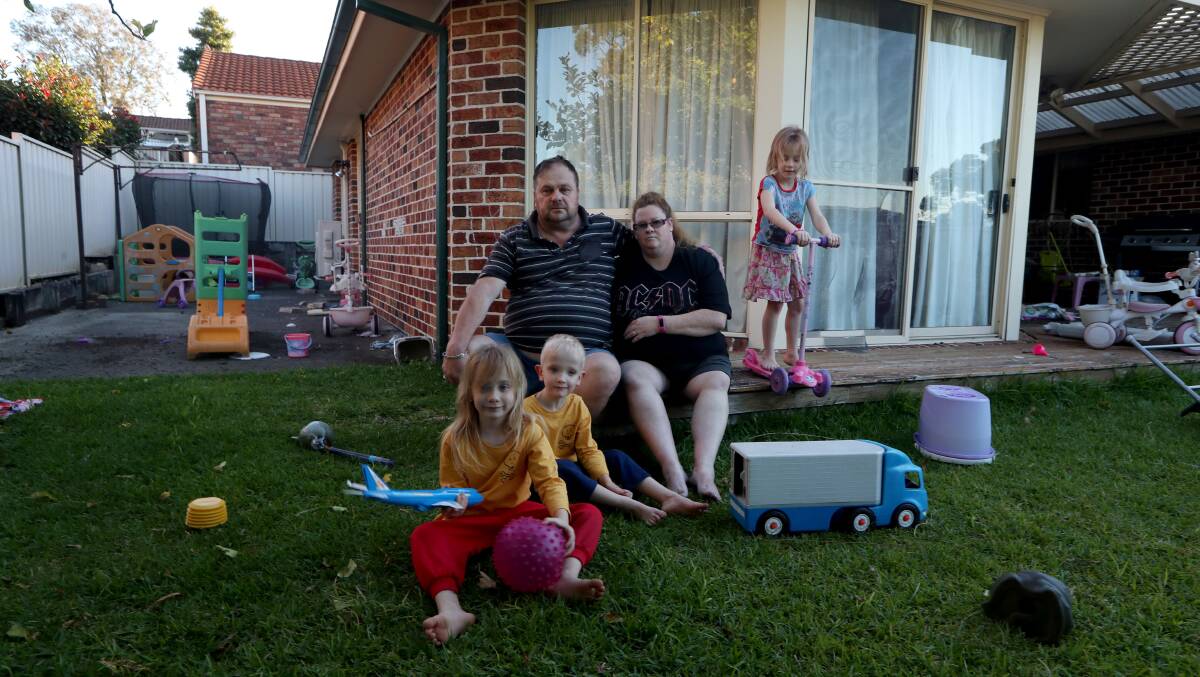 Out of options: Sharon and Stephen Smith with six-year-old triplets Sapphire, Cooper and Brianna at their rented Albion Park home, which they have to vacate by Saturday. Picture: Sylvia Liber