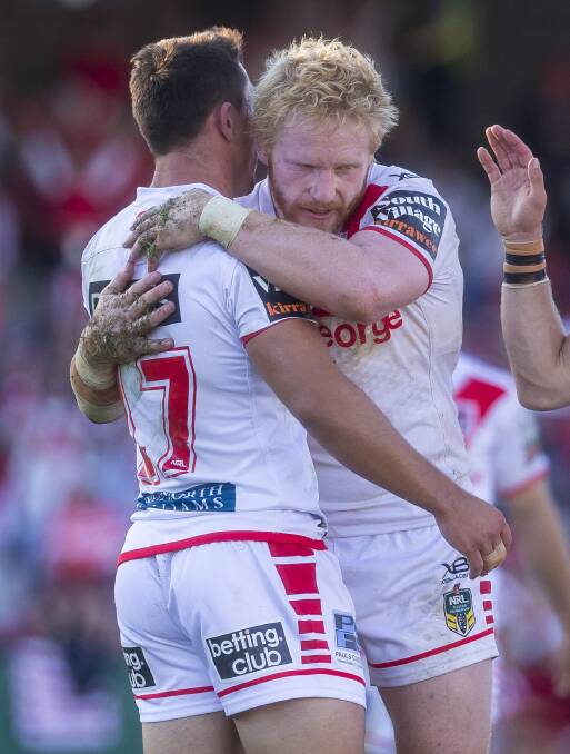 Reece Robson is embraced by James Graham on his debut. Picture: AAP 