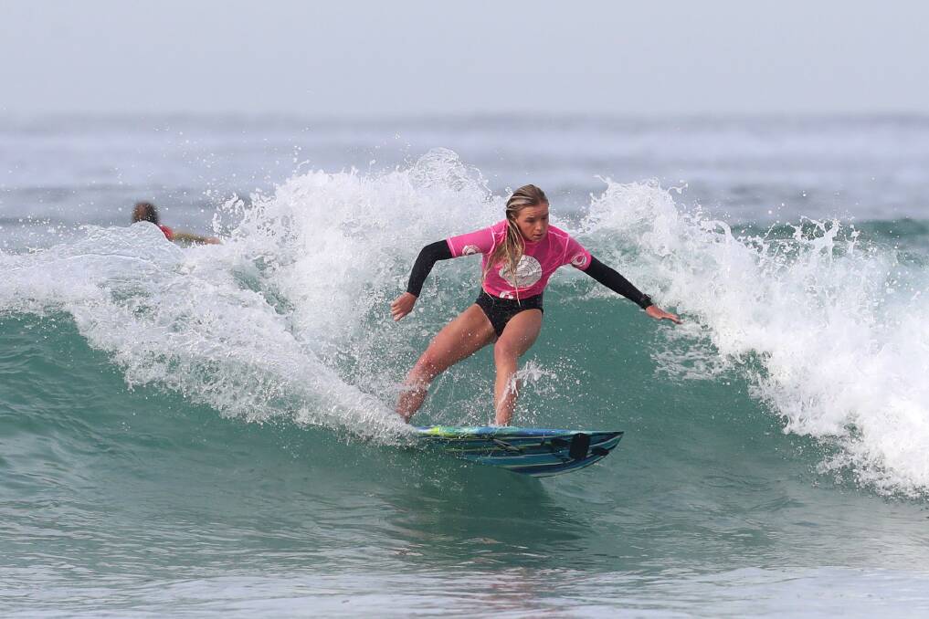 Riding high: Darci Air at last week's Pines Surfing School Competition where she was named most valuable female surfer. Picture: Sylvia Liber. 