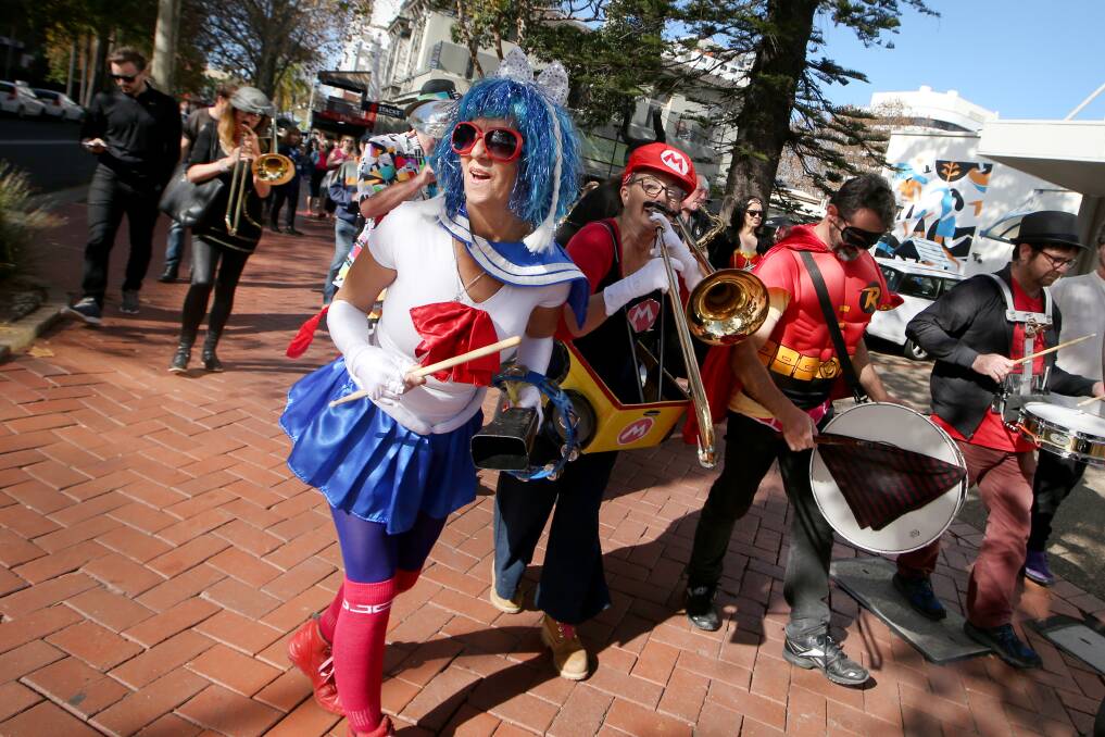 Jazz band The Con Artists performing in superhero style in and around Wollongong's Arts Precint. Picture: Sylvia Liber