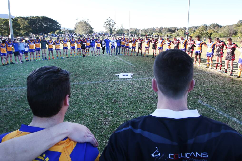 UNITED: Dapto and Collegians share a moment in the Canaries first game following the passing of Tory Brunning last season. Picture: Sylvia Liber. 
