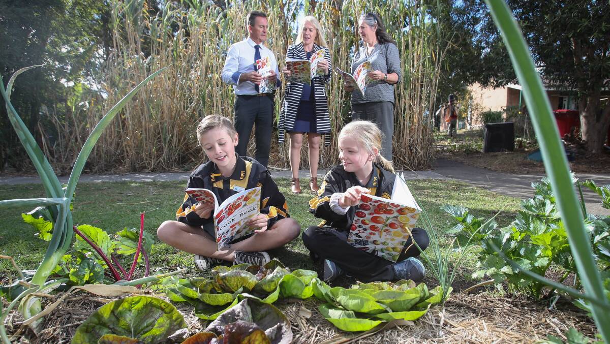 BREAKFAST OF CHAMPIONS: Albion Park Rail Public School students Jarrod and Dakota (front) with deputy principal Glenn Southwell, UOW Associate Professor Karen Charlton and Lisa Miller from ALL Sustainable Futures. Picture:  Adam McLean
