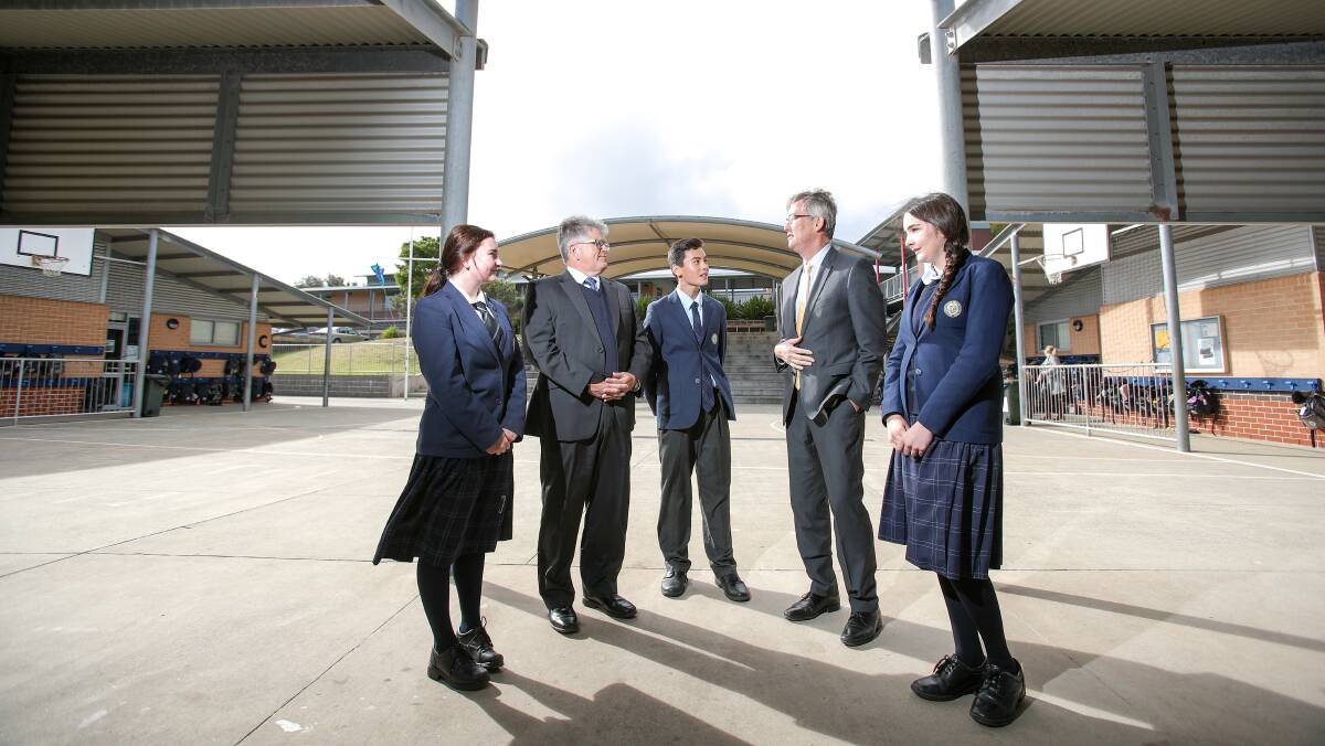 VISIT: Shellharbour Anglican College students Katie Egan, Mark Laird and Holly Hudson with Tony Cummings and NESA CEO David de Carvalho. Picture: Adam McLean