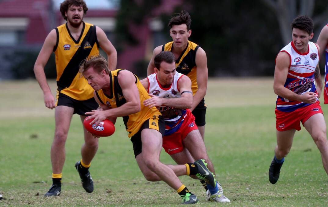 Caught: Northern Districts player Thomas Strong gathers the footy at Hollymount Park on Saturday.  Picture: Sylvia Liber