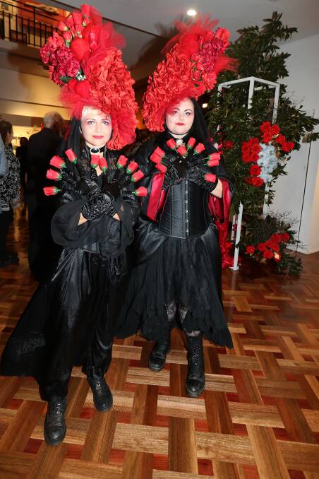 Performance artists Jem Lewandowski and Chantel Pickett entertained the crowd throughout a red themed gallery for the 40th anniversary celebrations. Picture: Sylvia Liber