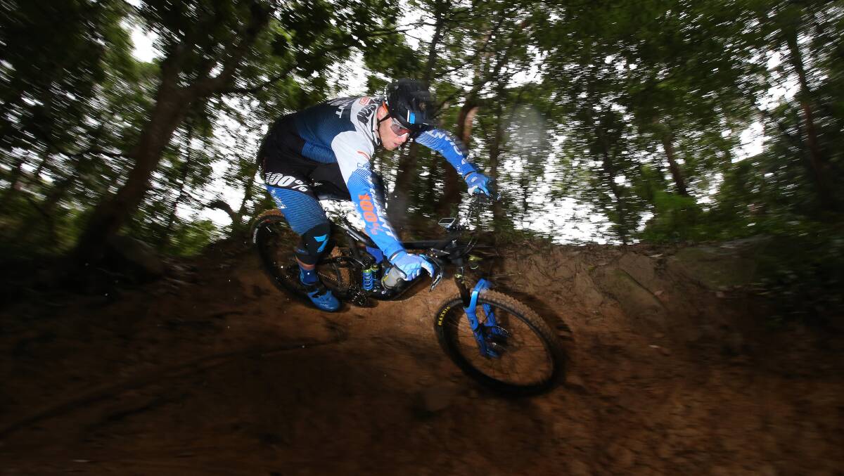 Quality local trails: Mountain biker Josh Carlson riding a trail on Mt Keira after his move back to Wollongong. Picture: Robert Peet.