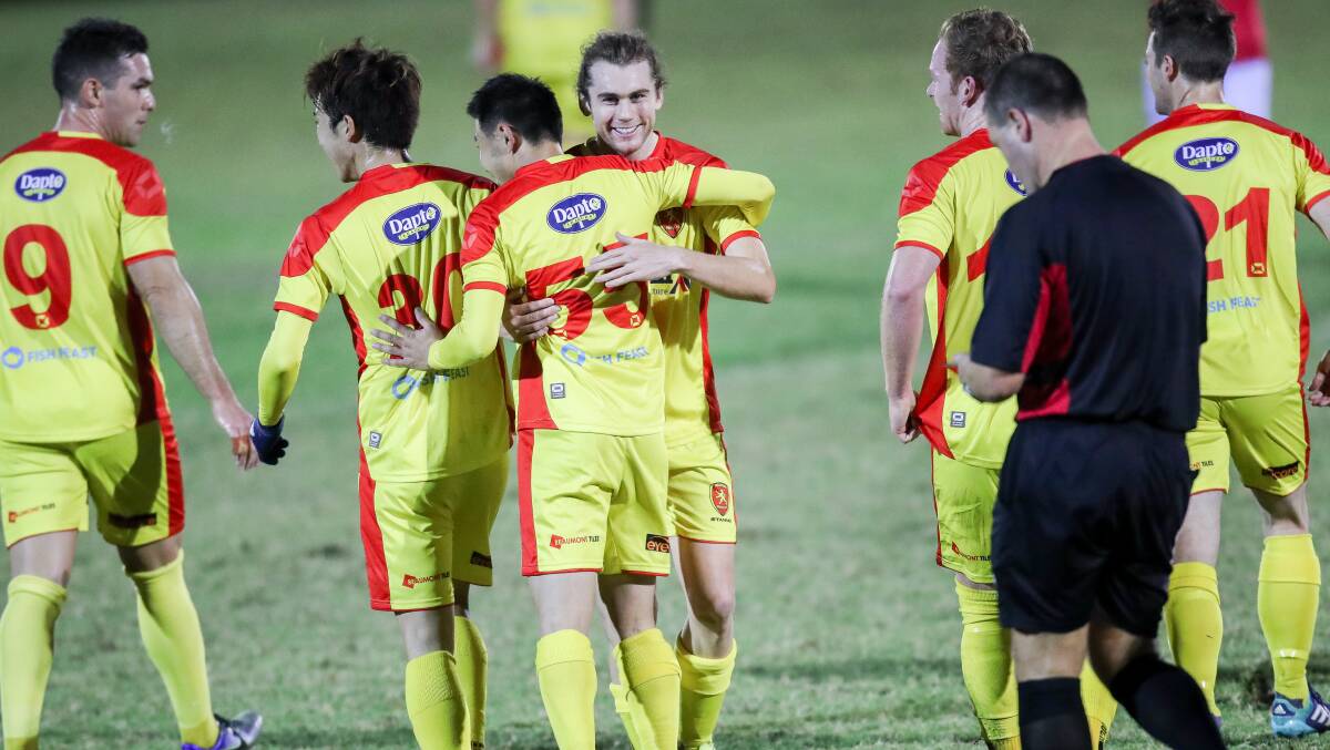 FINDING FORM: Wollongong United players celebrate with Kazuto Kushida earlier in the season. Picture: Adam McLean.