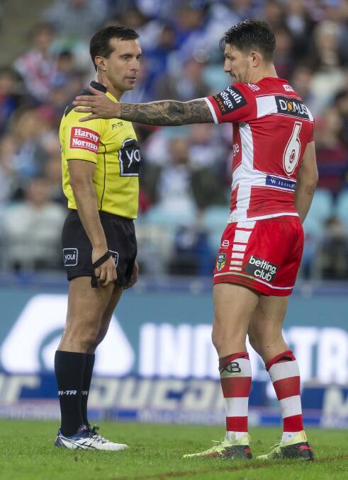 TOUGH GIG: Referee Matt Cecchin explains a penalty to Gareth Widdop midway through the Dragons clash with the Bulldogs last week. Picture: AAP Image