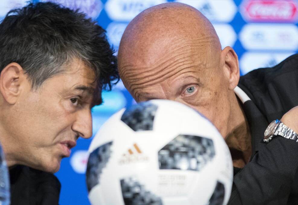 Behind the game ball: FIFA director of refereeing Massimo Busacca (left) and FIFA referees committee boss Pierluigi Collina during a news conference in Moscow this week.